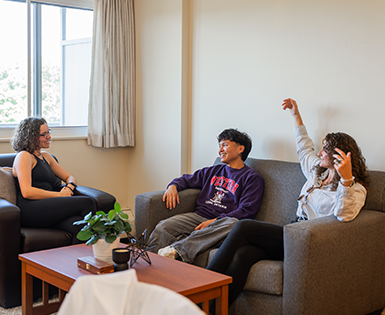 Three tenants talking in their living room