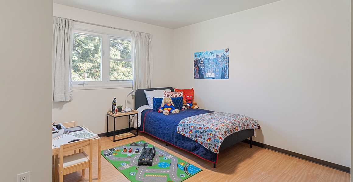 Kids bedroom showing bed and decor