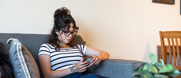 Woman on a couch reading