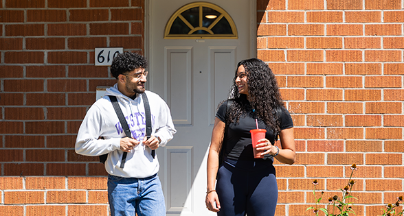 Two tenants out front of a townhouse